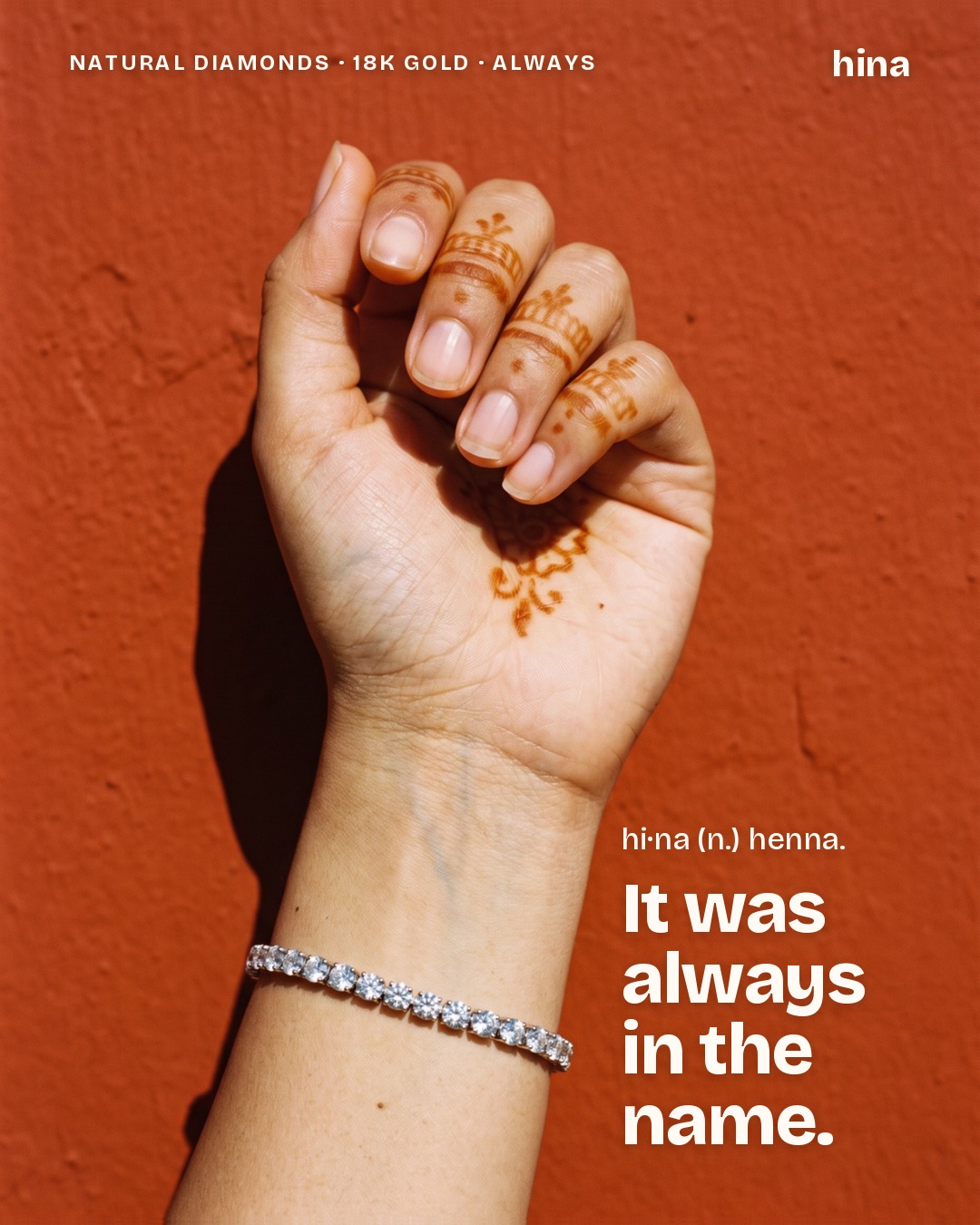 A hand with henna wearing a diamond bracelet